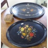A late 19thC black lacquered, oval papier mache tray, decorated with painted flora inlaid mother-