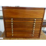 A modern mahogany coin collectors cabinet with straight sides and a hinged lid, over nine