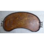 An Edwardian mahogany and marquetry kidney shaped twin handled serving tray with a pierced brass