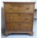 A 1920s oak three drawer dressing chest, raised on bracket feet  30"h  26"w