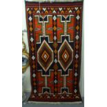 A Kelim rug with geometric motifs, on a multi-coloured ground  52" x 104"