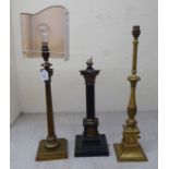 Three dissimilar cast metal table lamps: to include an early/mid 20thC example, fashioned as a
