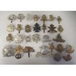 Approx. thirty military regimental cap badges and other insignia, some copies: to include The