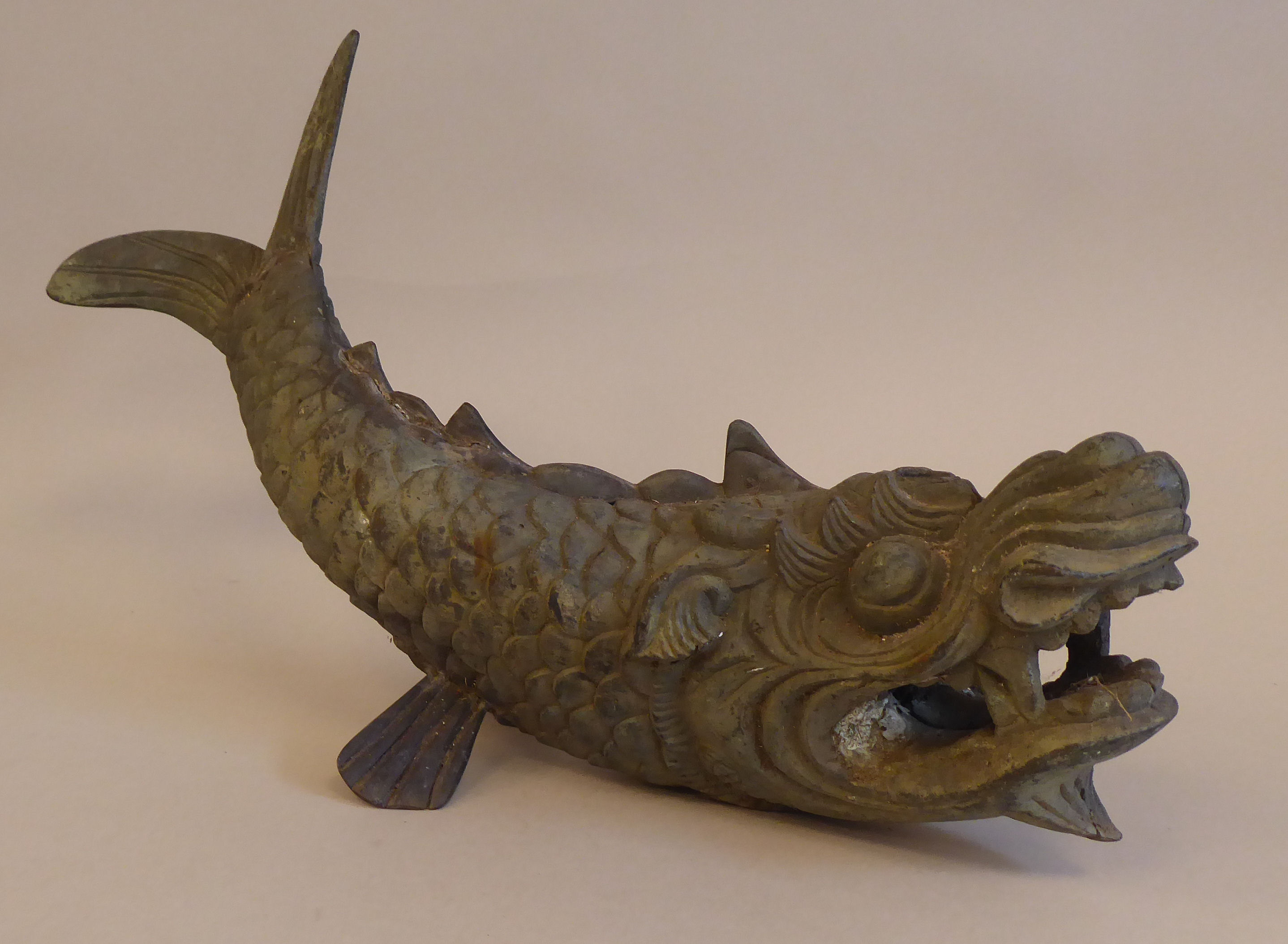 A late 19th/early 20thC Oriental cast bronze fountain head, fashioned as a 'Dragon-fish'  16"L