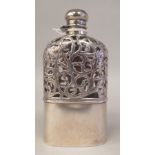A late 19thC Harris & Shafer shouldered glass hip flask, encased in Sterling silver, the lower