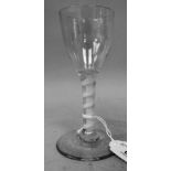 An 18th/19thC wine glass, the ovoid shape bowl on a cotton twist stem and domed foot