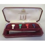 A Dunhill silver cigarette holder of tapered hexagonal form with four individually coloured