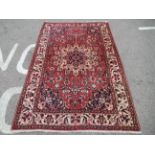 A Soumak rug, decorated with repeating stylised foliate designs, on a multi-coloured ground  62" x