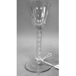 An 18th/19thC wine glass, the flared bowl on an airtwist stem and domed feet