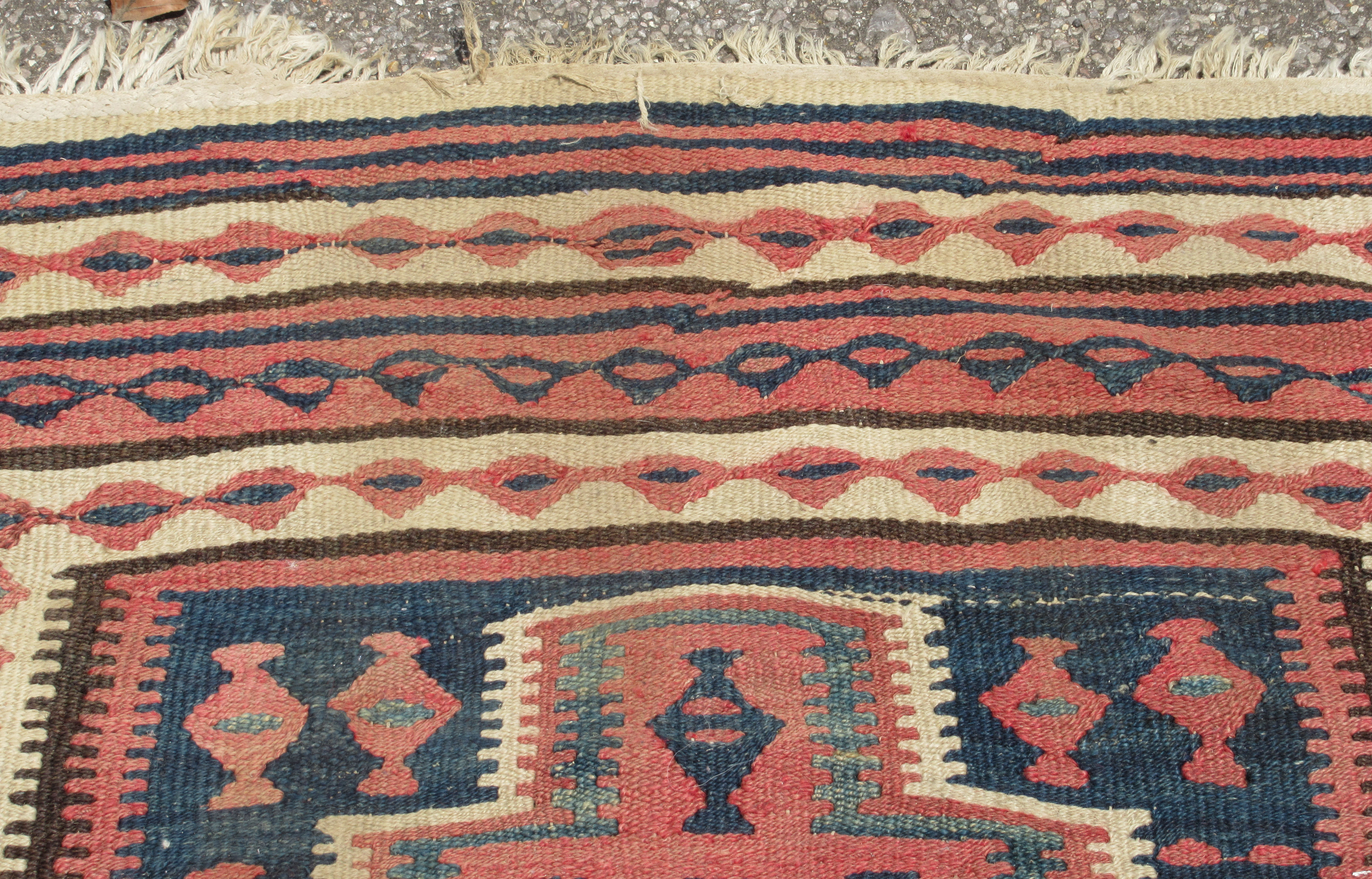 A Turkish Kelim rug, decorated with repeating geometric and other designs, on a brown ground  54" - Bild 4 aus 5