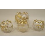 A set of four late 19thC spherical glass vases, having frilled rims, decorated in rococo foliate