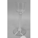 An 18th/19thC wine glass, the bell shape bowl on a double cotton twist stem