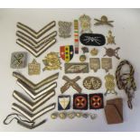 Miscellaneous 20thC military uniform cloth badges and various World War II Italian insignia, some