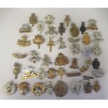 Approx. forty military regimental cap badges and other insignia, some copies: to include City of
