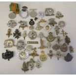 Approx. twenty-five military regimental cap badges and others, some copies: to include AAC;