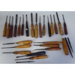 Approx. twenty-five early 20thC and later wood carver's chisels of varying design, most on handles