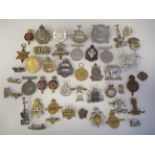 Approx. twenty-five military regimental cap badges, some copies: to include 1939-1945 Star; Highland