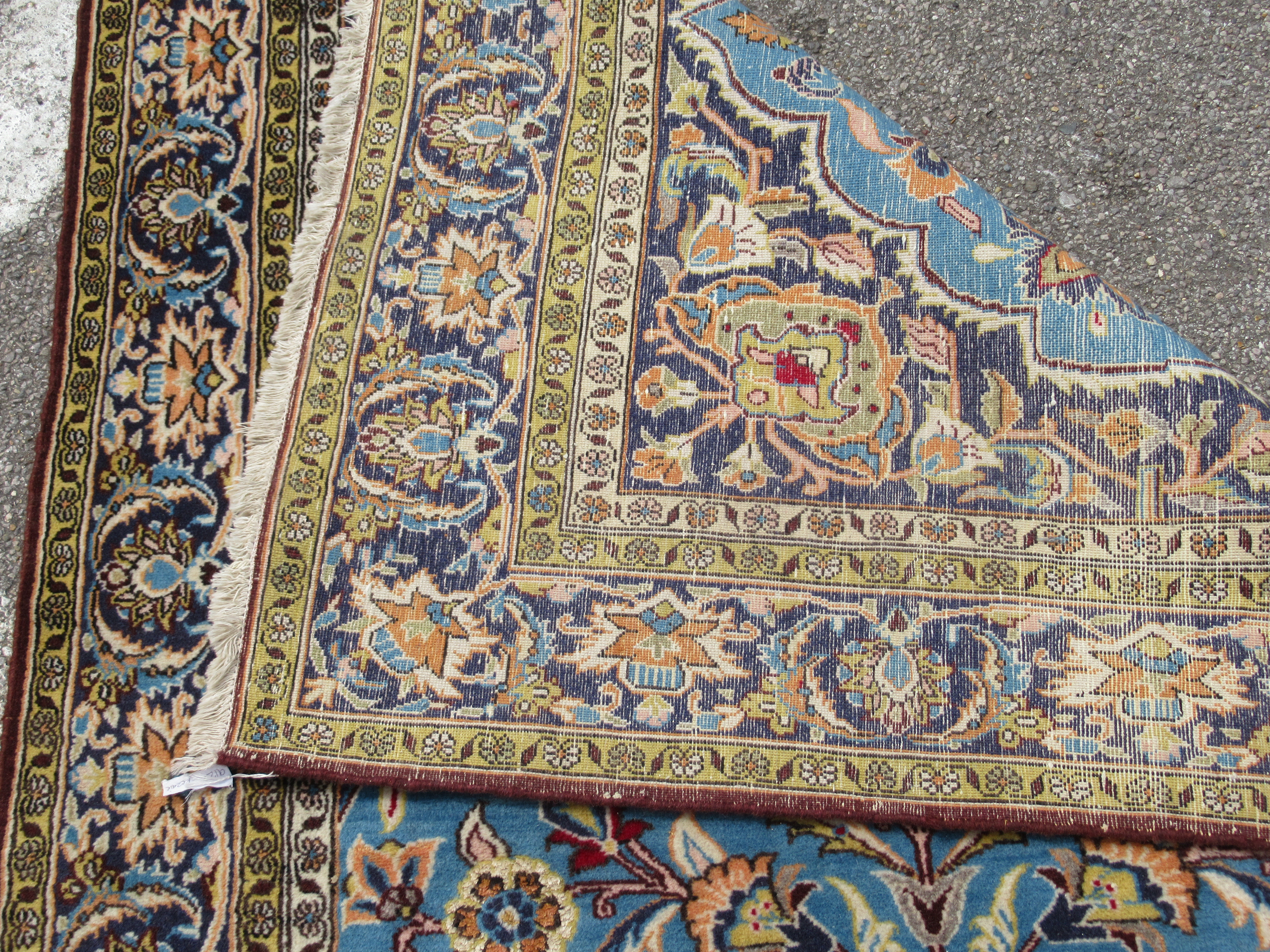 A Persian rug, decorated with exotic birds, flora and foliage, on a blue and multi-coloured - Bild 5 aus 5