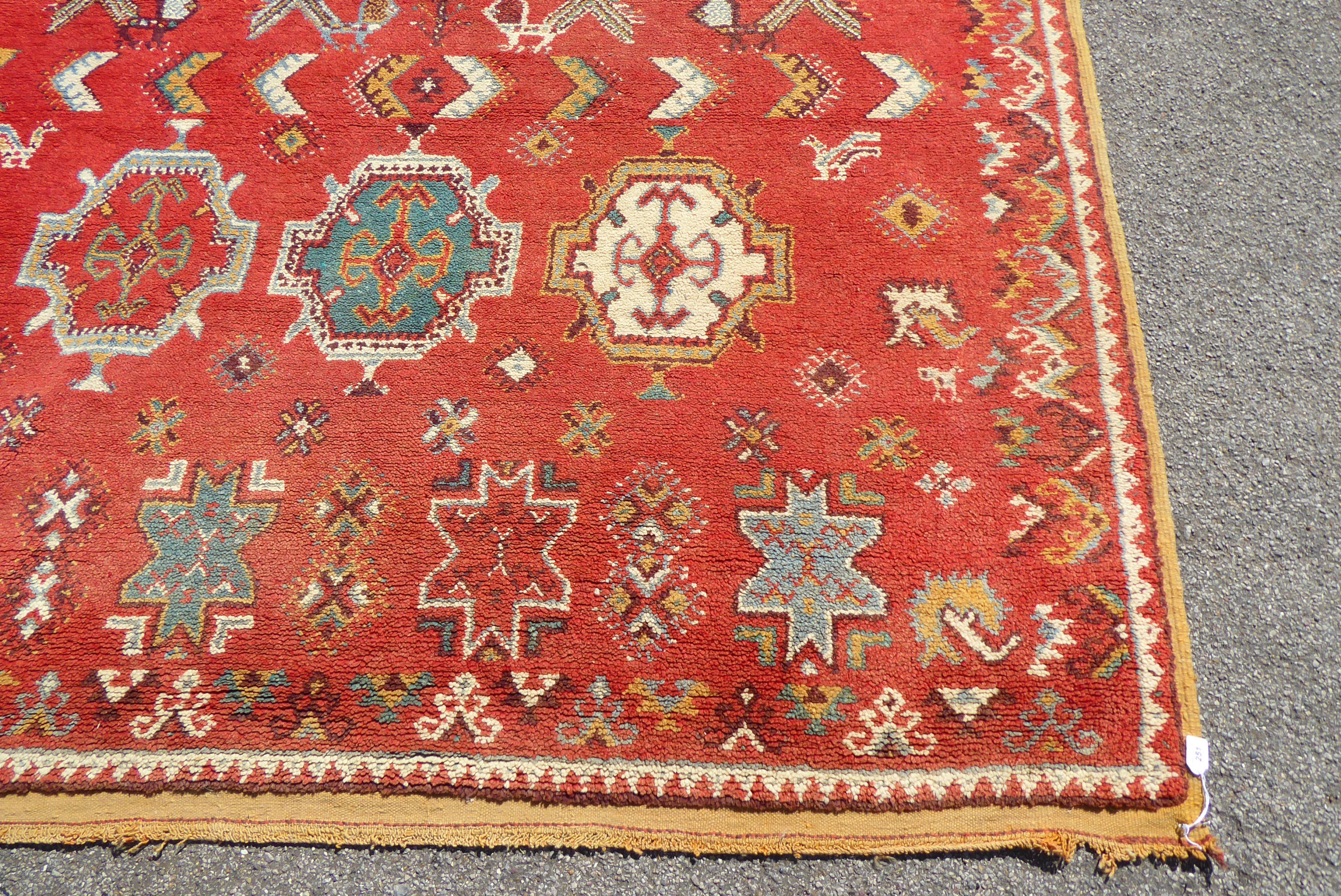 A mid 20thC Turkish carpet with birds and geometric motifs on a red ground  115" x 82" - Bild 2 aus 8