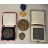 A 1925 Masonic Gratitude silver gilt medal, on a blue ribbon; a 1900 bronze medallion Monnaie de