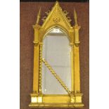 A 19thC Continental carved giltwood and gesso framed niche mirror of gothic design with a painted