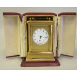 An early 20thC lacquered brass cased carriage timepiece, having bevelled glass panels and a
