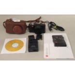 A Leica D-Lux3 camera (No.3237195) in a dedicated, moulded and stitched mid brown hide case with a