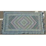 A Soumak rug with geometric designs on a blue ground  90" x 56"