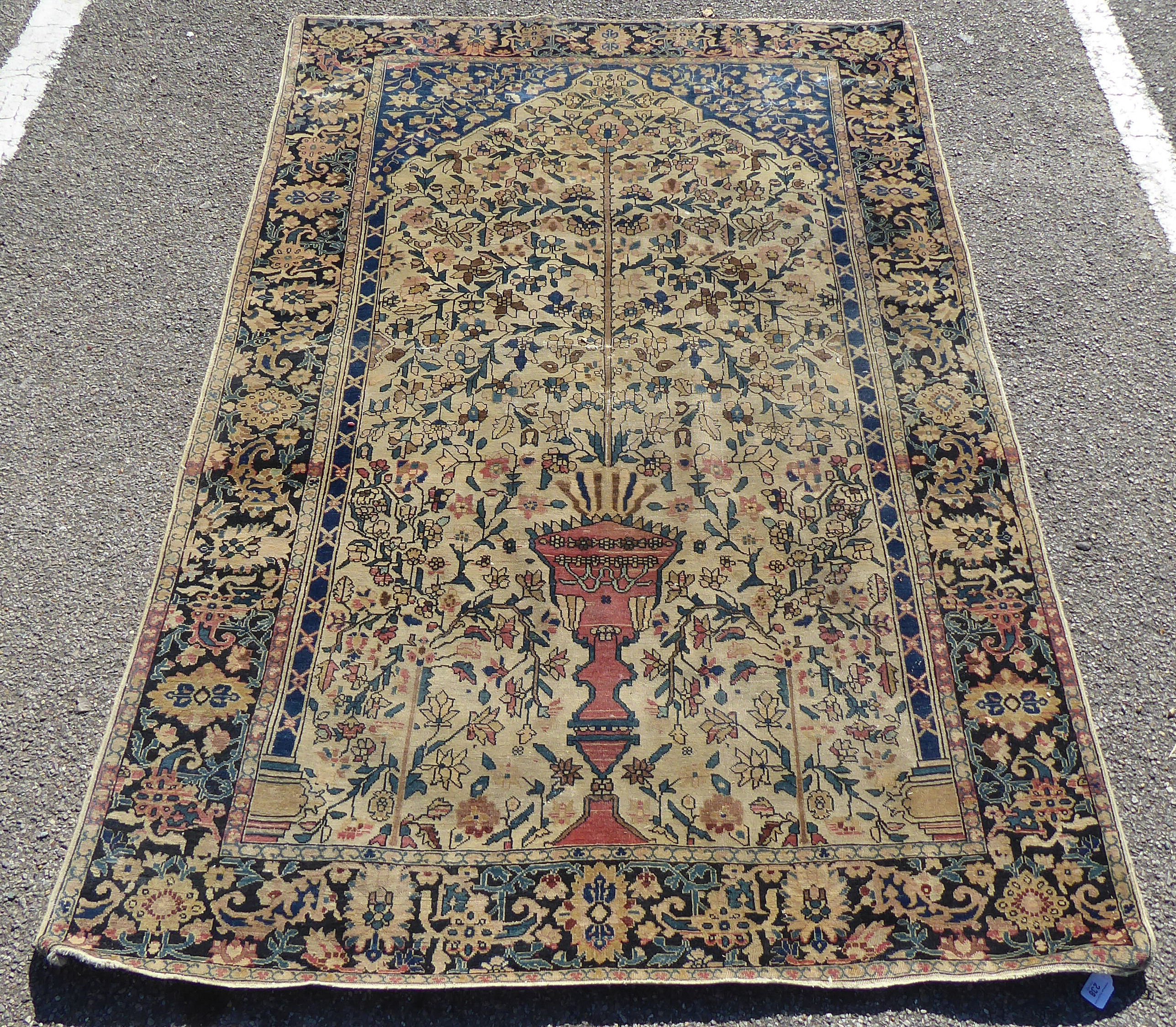 An Isfahan prayer rug with a tree-of-life design within a palmette border on a cream ground  80" x