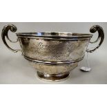 An Edwardian silver trophy rose bowl with an applied wire waistband and rim and opposing C-