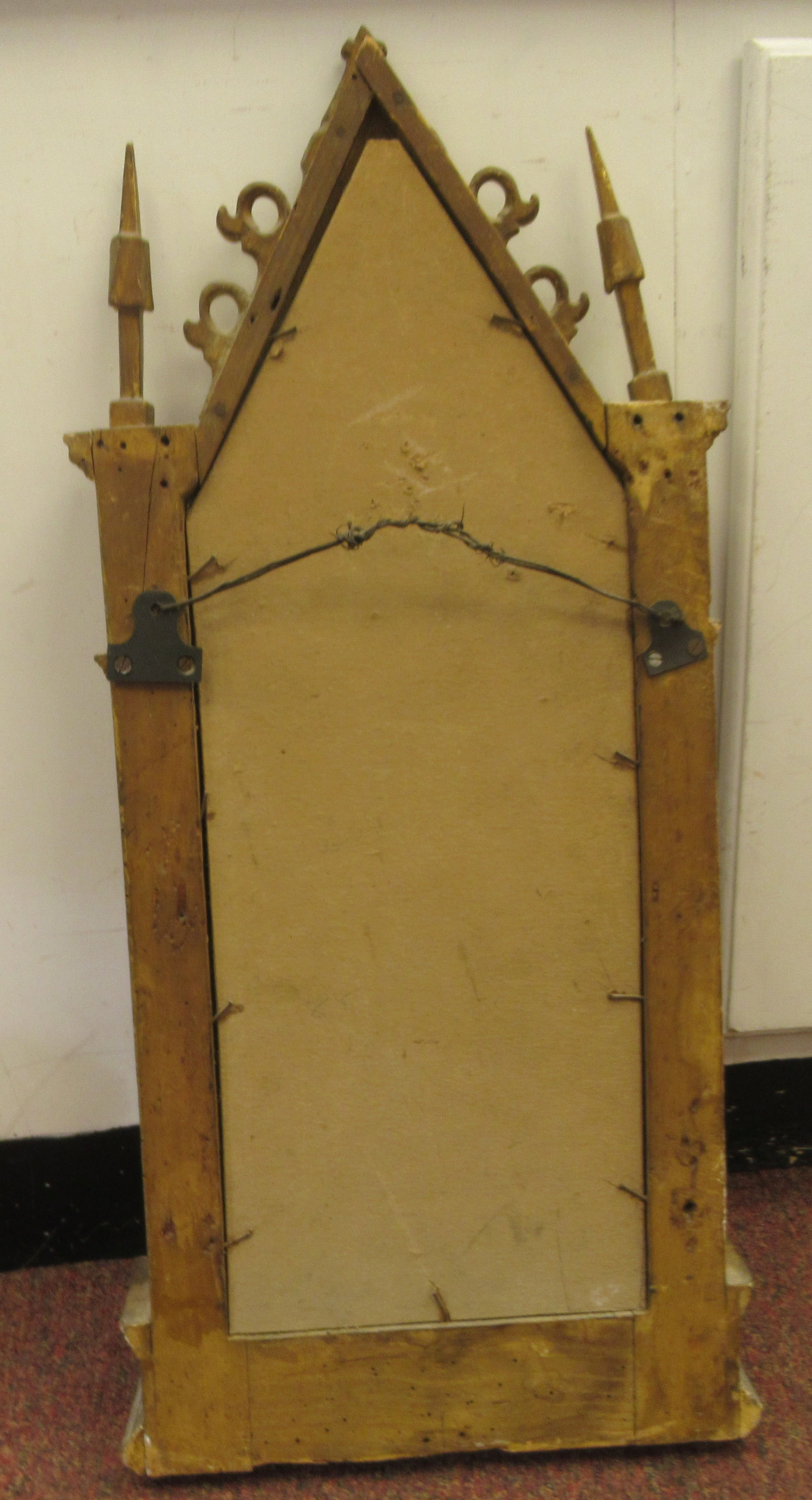 A 19thC Continental carved giltwood and gesso framed niche mirror of gothic design with a painted - Image 4 of 4