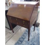 An Edwardian string and ebony inlaid mahogany bureau, the fall flap enclosing a part fitted