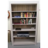 A modern grey painted oak and pine open front bookcase with height adjustable shelves, on a