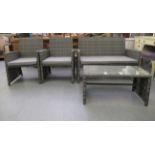 A four piece grey coloured rattan terrace furniture set, comprising a two person settee, two arm