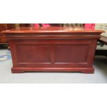 A modern mahogany storage box with straight sides and a hinged lid, raised on bracket feet  20"h