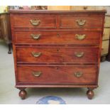 An early 19thC mahogany dressing chest with two short/three long drawers, raised on turned legs