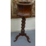 A late 19thC stained beech jardinière stand, raised on a barleytwist column and tripod base  37"h