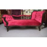An Edwardian stained hardwood, fret carved, showwood framed chaise longue, part button upholstered
