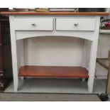 A modern grey painted and stained pine, two drawer hall table, raised on square, tapered legs,