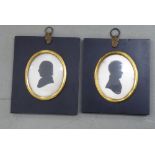 Two similar early 19thC oval head and shoulders silhouette portrait miniatures, in oval, gilt