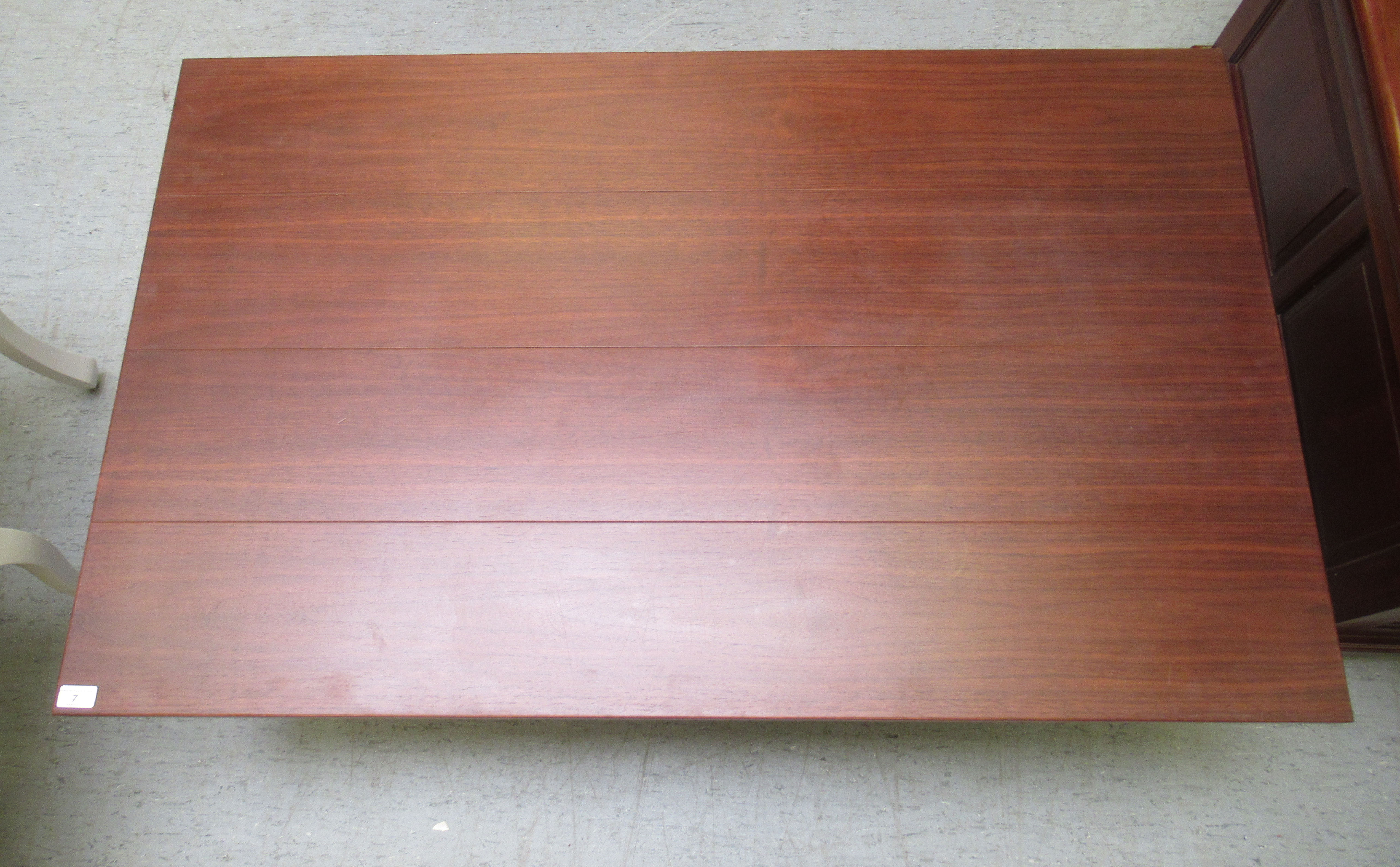 A modern teak coffee table, raised on block legs  16"h  51"w  31"deep - Image 2 of 3