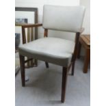 A mid 20thC Beresford & Hicks mahogany framed desk chair with a grey hide upholstered back and seat,