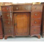 A Regency mahogany breakfront sideboard with three drawers and three cupboard doors, raised on