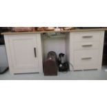 A modern grey painted light oak and pine twin pedestal dresser with a cupboard door, opposite and