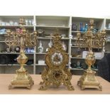 A 20thC Victorian style lacquered brass mantel clock of ornate pierced scrolled design; the 8 day