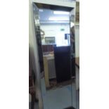 A modern freestanding cheval mirror, on an easel back  58"h