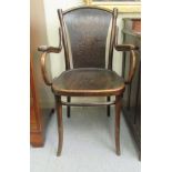 An early/mid 20thC stained beech, panelled and bentwood framed open arm chair