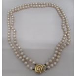 A double row pearl necklace, on a 9ct gold clasp