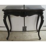 A late 19thC black lacquered mahogany serpentine front tea table, the rotating, foldover top over