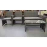 A four piece grey coloured rattan terrace furniture set  comprising a two person settee, two arm